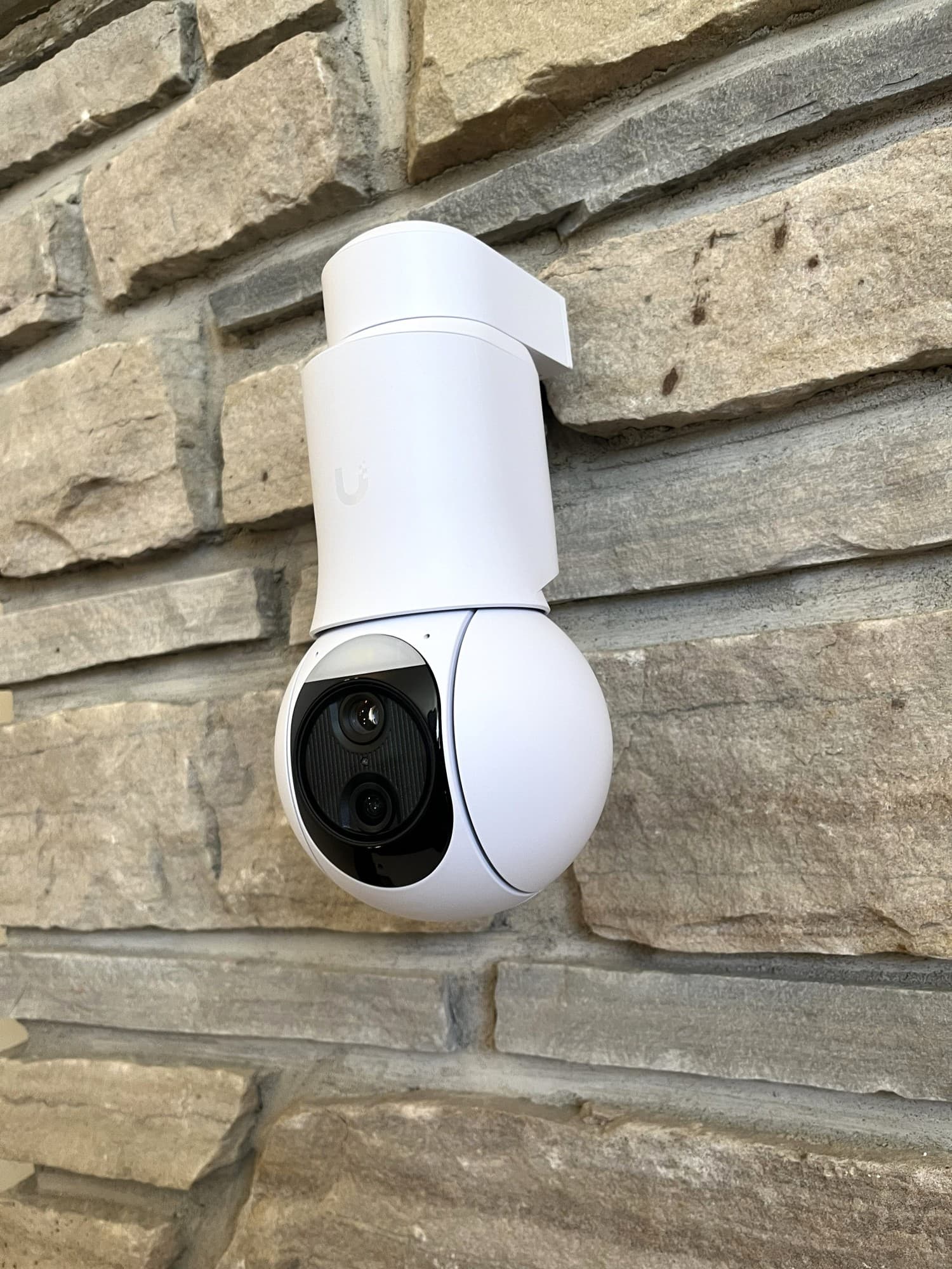 Home surveillance system installed on stone exterior in Oakville
